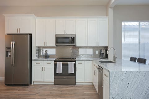 New white shaker cabinets and top of the line GE Appliances