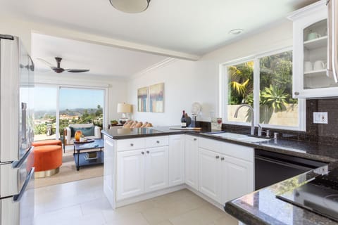 Kitchen looks onto the Ocean and Infinity Pool