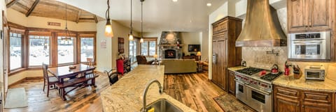 Amazing kitchen wolf stove ,nook area looking out to back yard /golf course