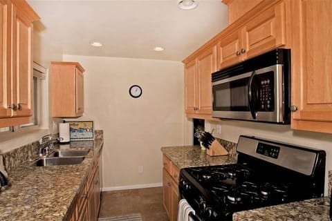 Kitchen leading to living area
