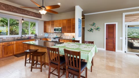 Spacious Kitchen with large island. Well equipped with spices, oils.