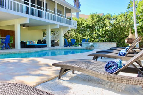 Outdoor pool, a heated pool, sun loungers