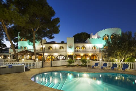 Outside pool area at night.