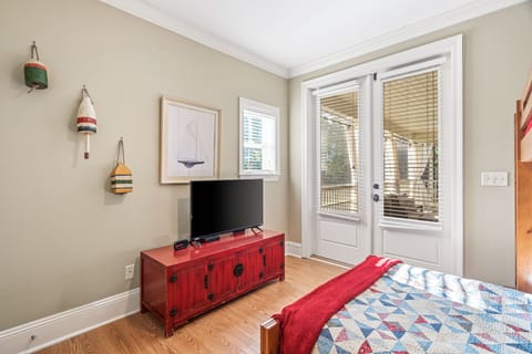 2nd Floor Bunk Room (1 Full & 1 Twin) shares a hallway bathroom with the additional King bedroom. This room has access to the spacious screened-in balcony