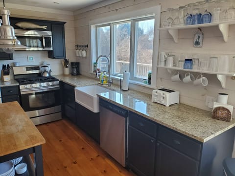 Fully equipped kitchen with granite, stainless appliances & butcher block island