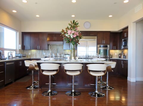 Large kitchen with granite island that is great for brunches & wine tastings
