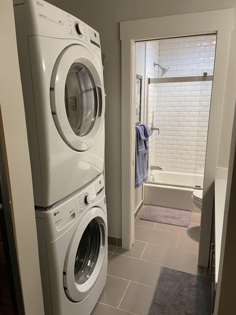 Full sized washing machine (summer 2020), detergent in cabinet to right