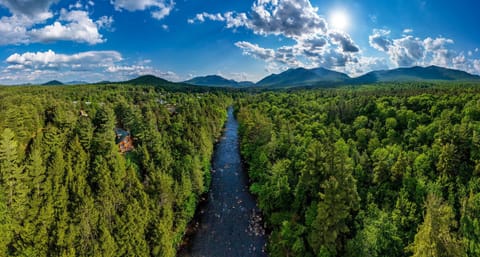 Wilmington Range Chalet drone 180 degree panorama over Ausable River summer