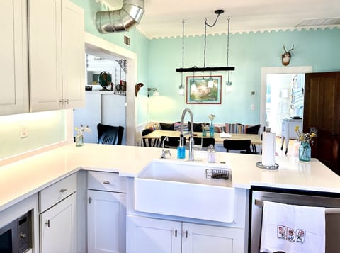 Updated kitchen with large capacity fridge, MW, dishwasher & 5 burner stove.