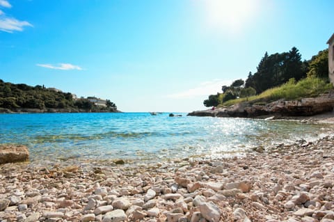 Beach nearby, sun loungers