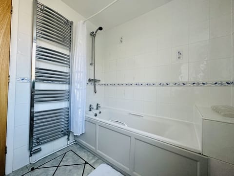 Combined shower/tub, hair dryer, soap, toilet paper