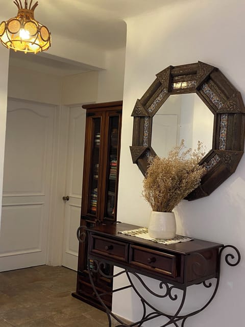 hallway and bookcase full of reading material