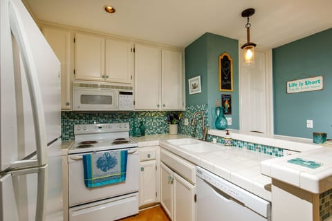 Glass tiles in the colors of the sea set the palette for the beach front condo.