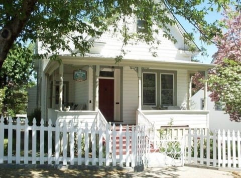 Welcome! Enjoy a cup of coffee & a good book on our charming wrap around porch!