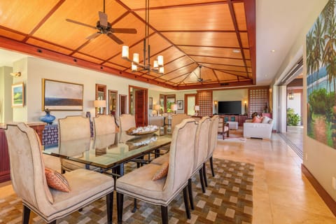 Enjoy tropical meals in this formal dining room with seamless access to both kitchen and outdoor spaces.