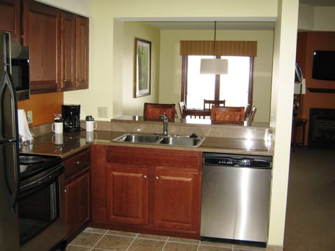 Full kitchen with fridge, stove and dishwasher