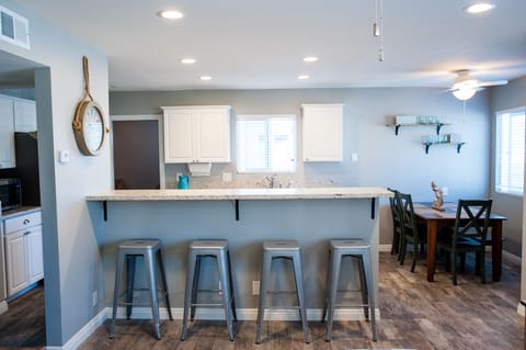 The bar can seat an additional 4 guests