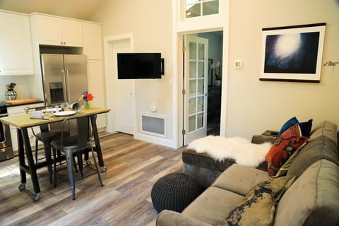 Living room/Dining area with French door to bedroom