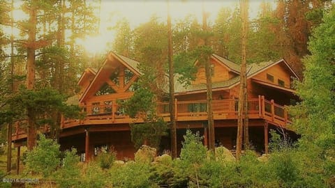 Nestled in the woods with huge wraparound deck!