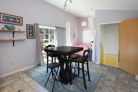 Entry from stairs to 2nd level kitchenette area (Full Bed in background) w/ deck