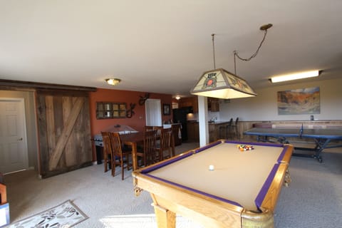 Bar-height dining table, bubble hockey, pool table