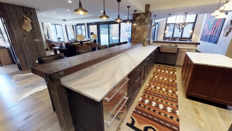 kitchen, family, dining to siding doors and outdoor patio and hot tub