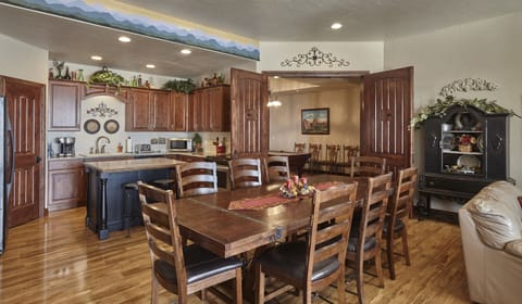 Kitchen and dining area with table for 8 plus fold out leaves for 4 more chairs