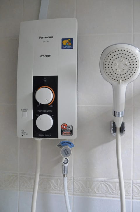 Combined shower/tub, hair dryer, towels, soap