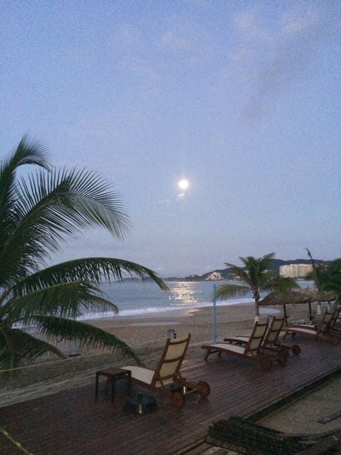 On the beach, sun loungers, beach towels