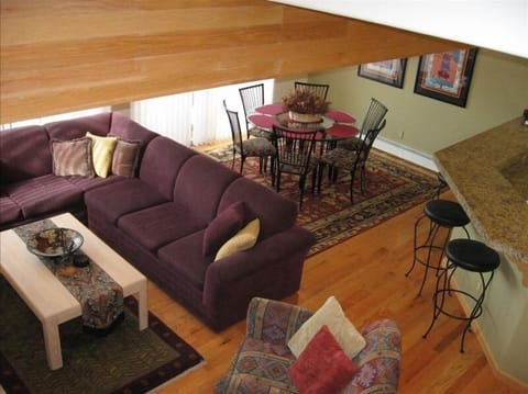 Main living, dining and kitchen area on main floor. Attached balcony with view