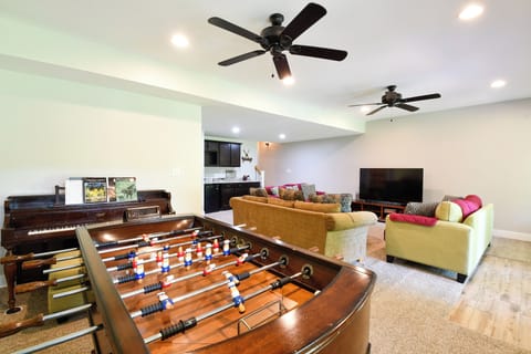 Basement Recroom: Foosball, 70" smart TV with Dish Network, wet bar, piano