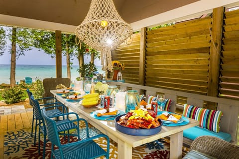 Covered porch is perfect for dining with family and friends. 