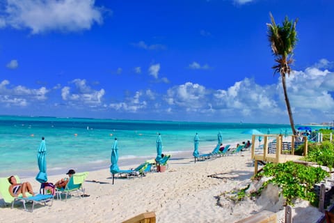 On the beach, sun loungers, beach towels