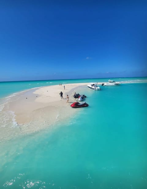 On the beach, sun loungers, beach towels