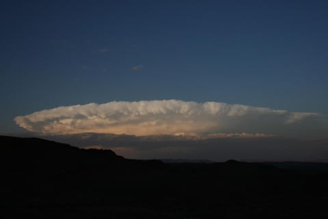 "there's a storm across the valley, clouds are rolling  in"...john denver