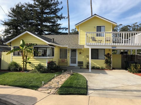 Oh so cute!  Parking for two cars in the driveway.