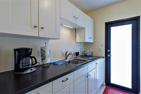 Kitchen even has stocked spice cupboard.