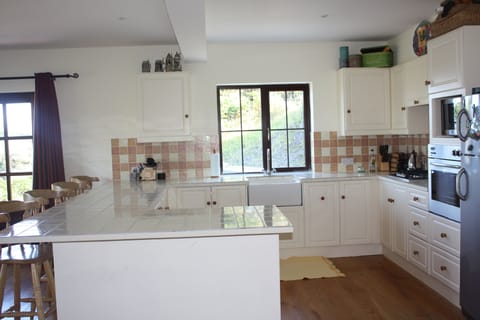 Kitchen includes; full fridge with freezer, dishwasher, wall oven and stove