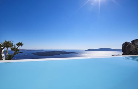 A heated pool, sun loungers