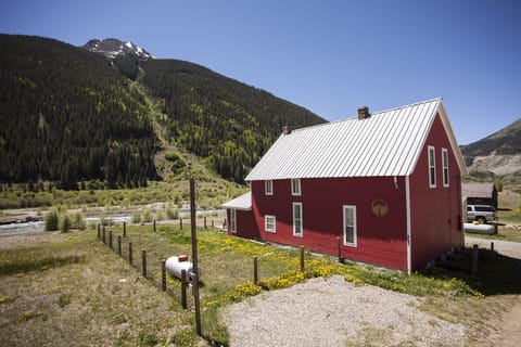 Exterior of house looking toward the river with Kendall Mountain. 