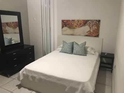 Bigger bedroom with a queen size bed, futon and AC unit. Sleep 3