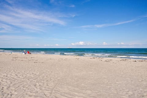 On the beach, sun loungers, beach towels