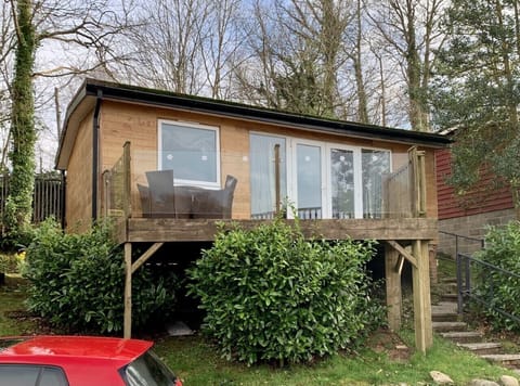 Front of the chalet over looks the lake at Glan Gwna