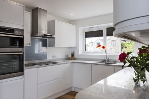 Kitchen - Double oven, Induction Hob.  Integrated dishwasher and washer/dryer