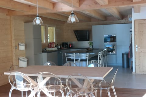 The dining room and the kitchen.