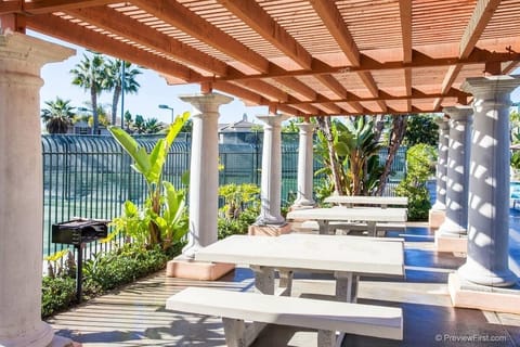 Grill and sitting area at community pool.