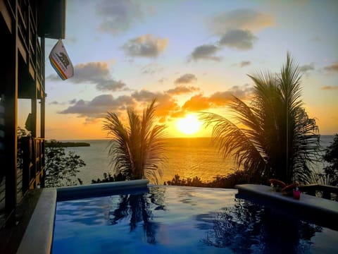#sunsets in the infinity edge pool overlooking the Caribbean Sea #CasaCaribeRoat