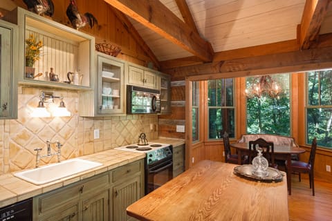 Full kitchen with stove, microwave, dishwasher, coffee maker,  and more