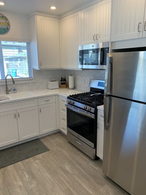 Newly remodeled kitchen with all new appliances, cabinets, & flooring