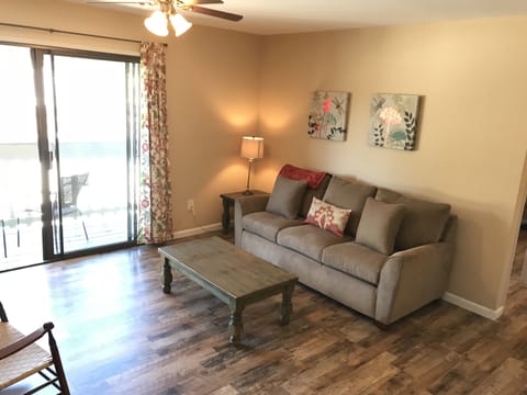 Oak laminate flooring and a Lazy Boy pull-out couch new in Aug. 2018.